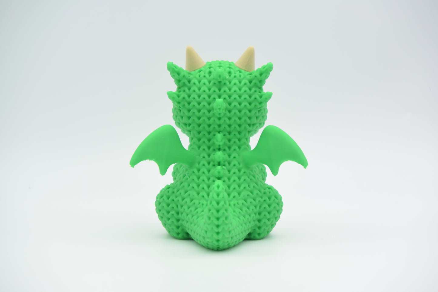Knitted Dragon Topkinz character rear three-quarter view