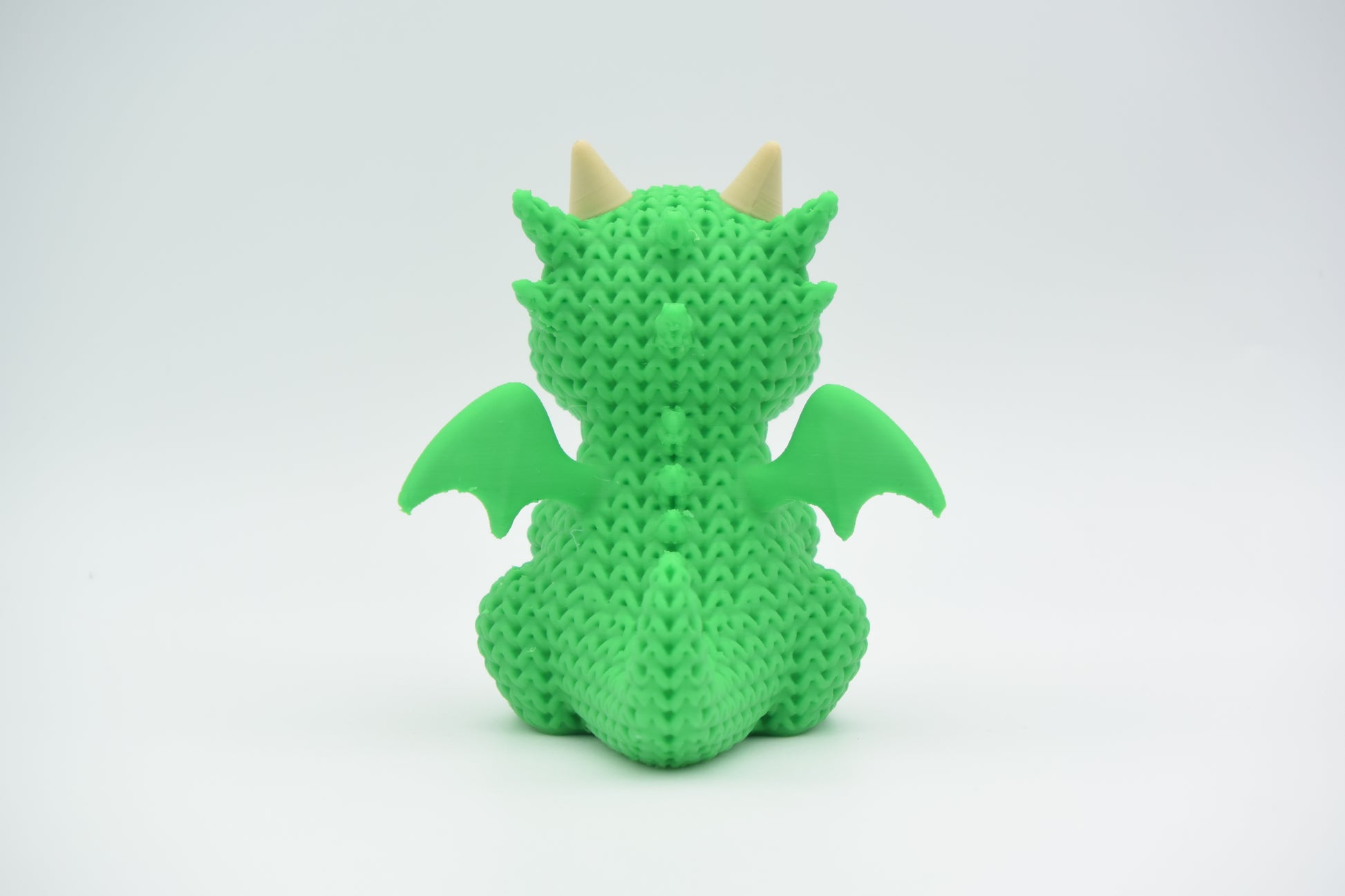 Knitted Dragon Topkinz character rear three-quarter view