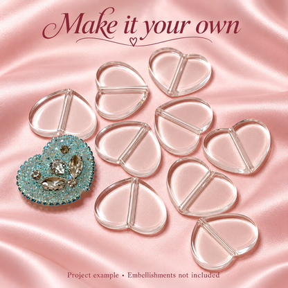 Clear acrylic heart plate blanks beside a decorated aqua rhinestone project example. Embellishments not included.