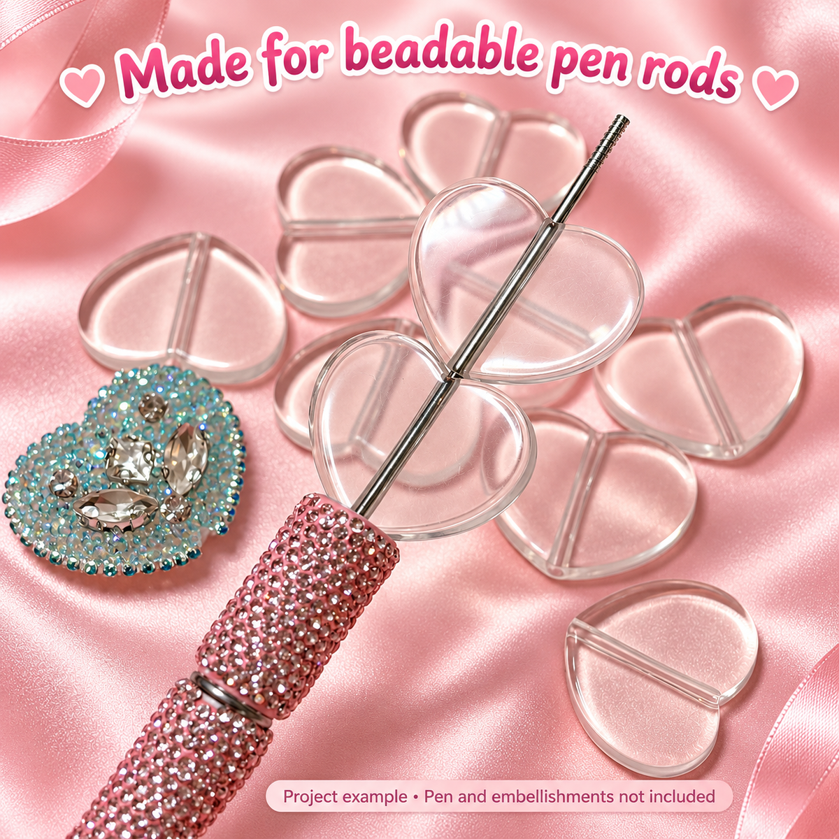 Clear heart plate base beads threaded onto a beadable pen rod. Pen and embellishments not included.