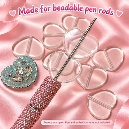 Clear heart plate base beads threaded onto a beadable pen rod. Pen and embellishments not included.
