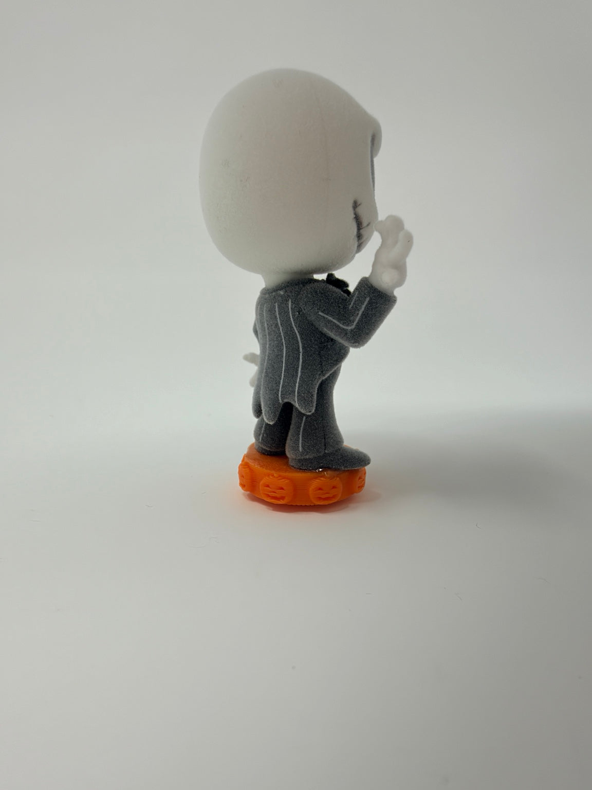 Original photo of a character on an orange Jack-o’-Lantern Character Mount. Character not included.